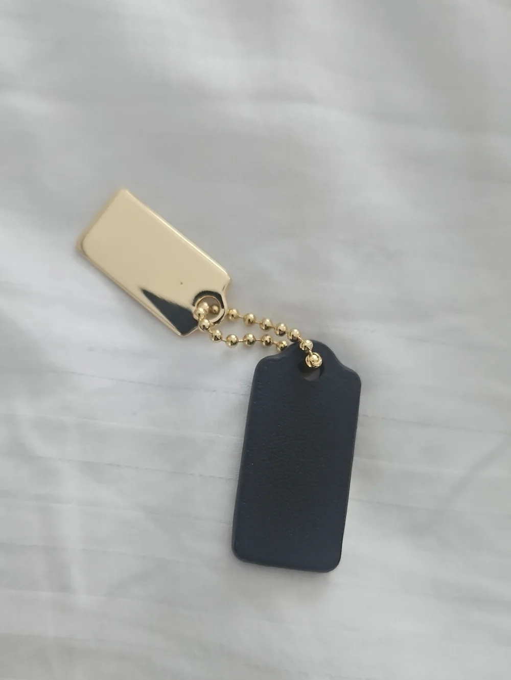 Coach Metal And Leather Tag